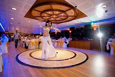 A bellydancer dances at the istanbul bosphorus dinner cruise show
